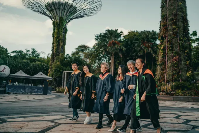 group of young people graduation smiling