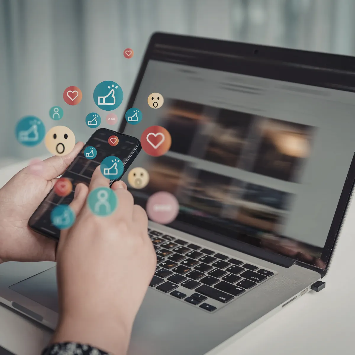 a laptop showing social media emojis