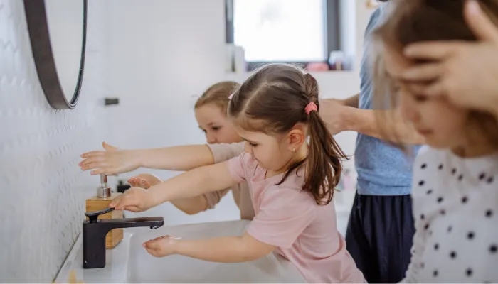 Kids washing their hands before school. 