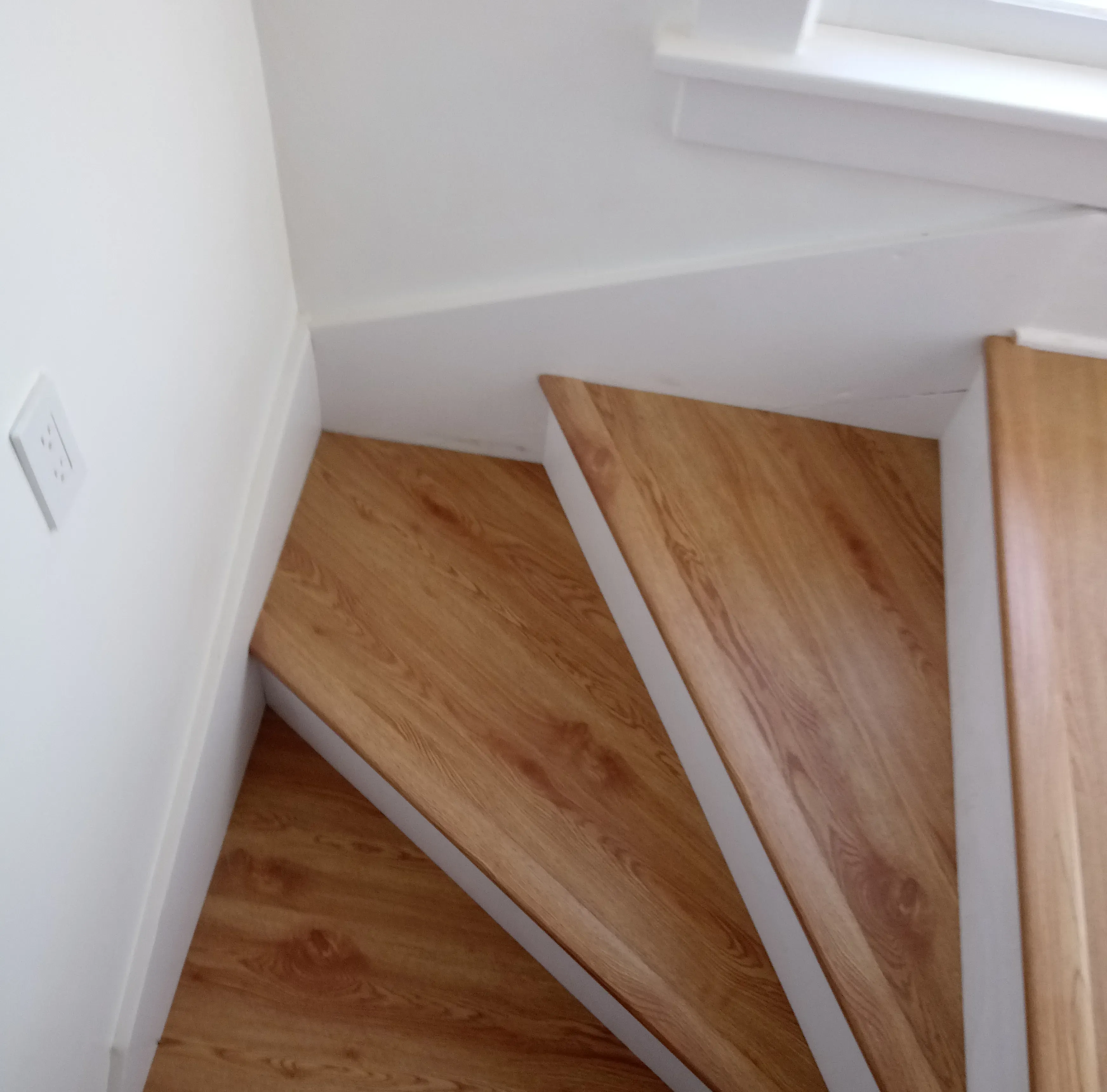 Finished wood staircase reconstruction 