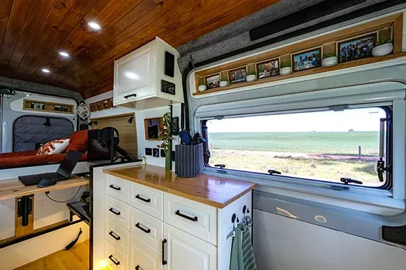 Additional kitchen storage and cabinetry inside campervan