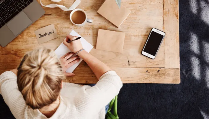 A mom writing thank you notes.