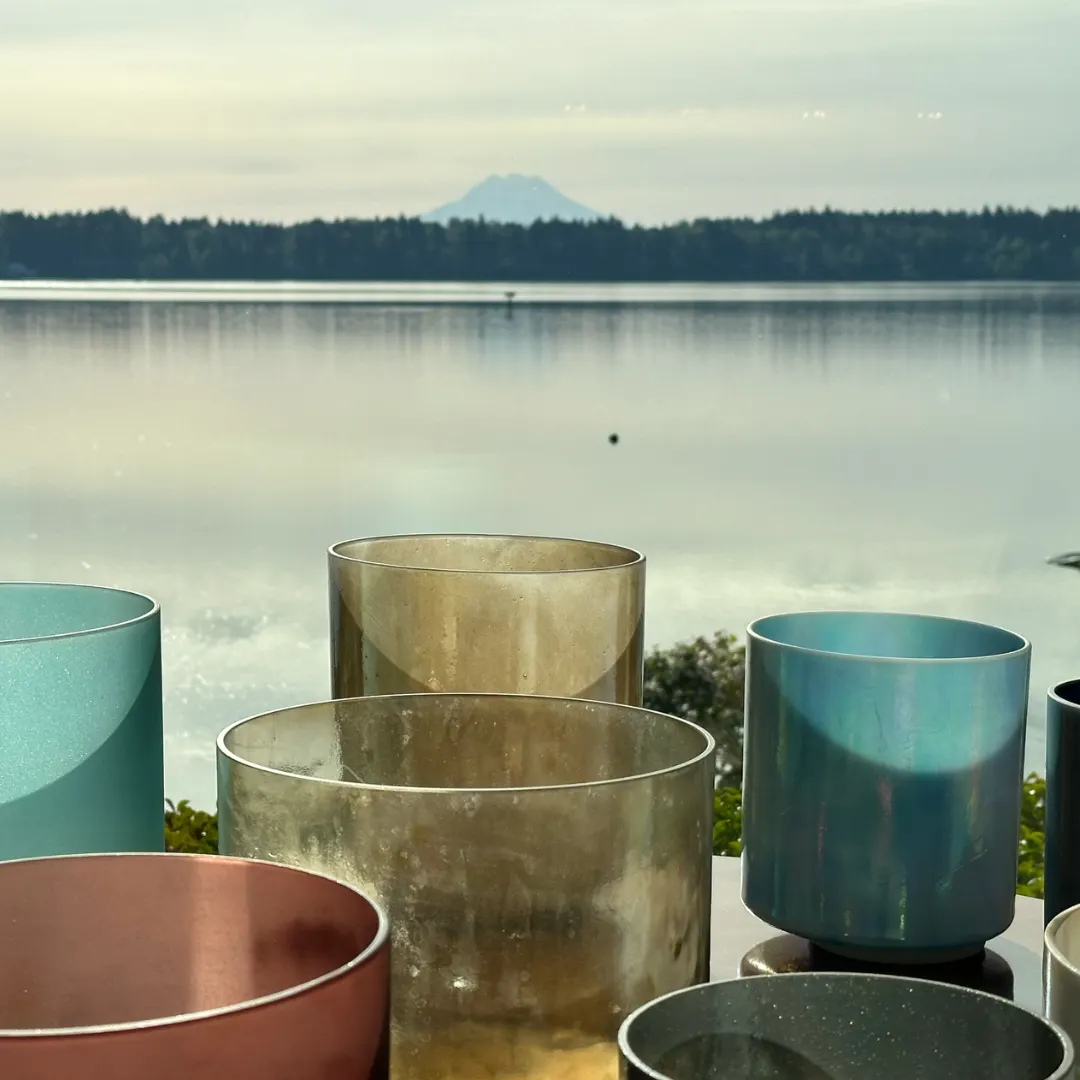 Crystal Bowl Sound Bath in front of a lake