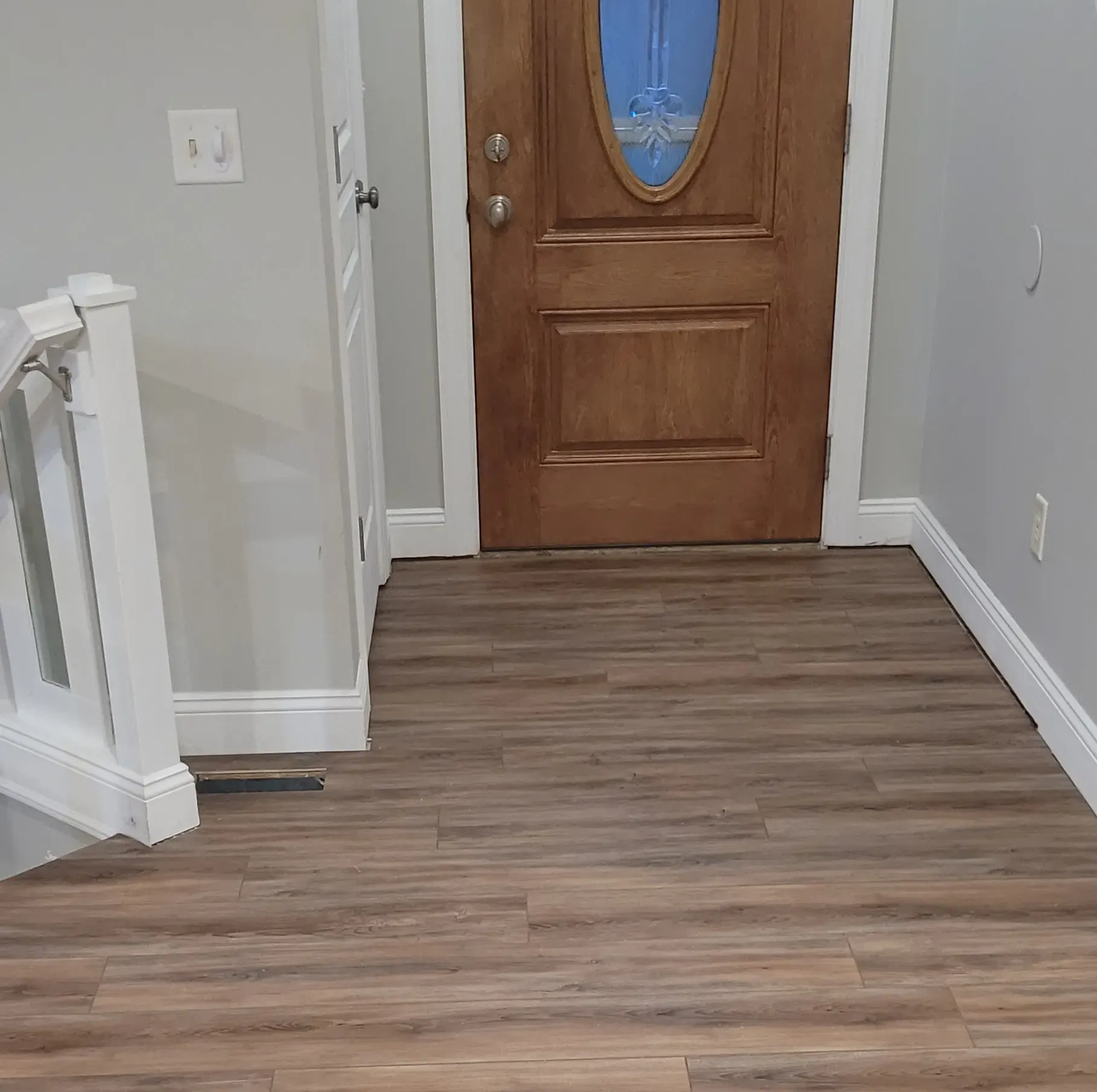 completed wood floor installation in entry way 