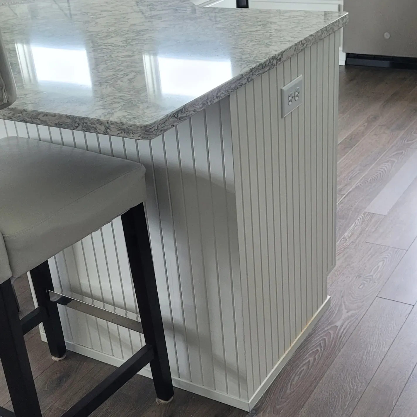 Island in kitchen with side boarding 
