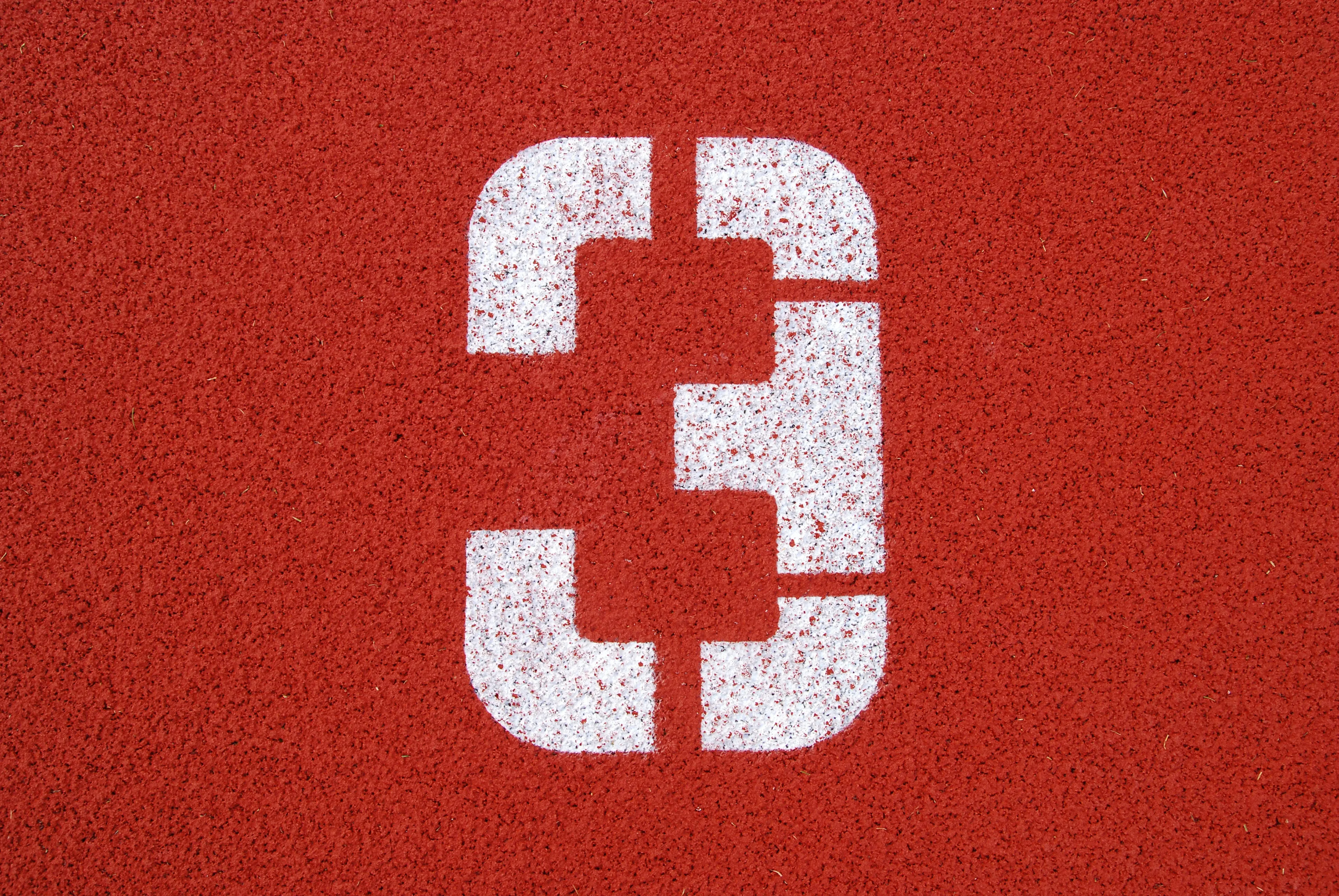 The number 3 on red background