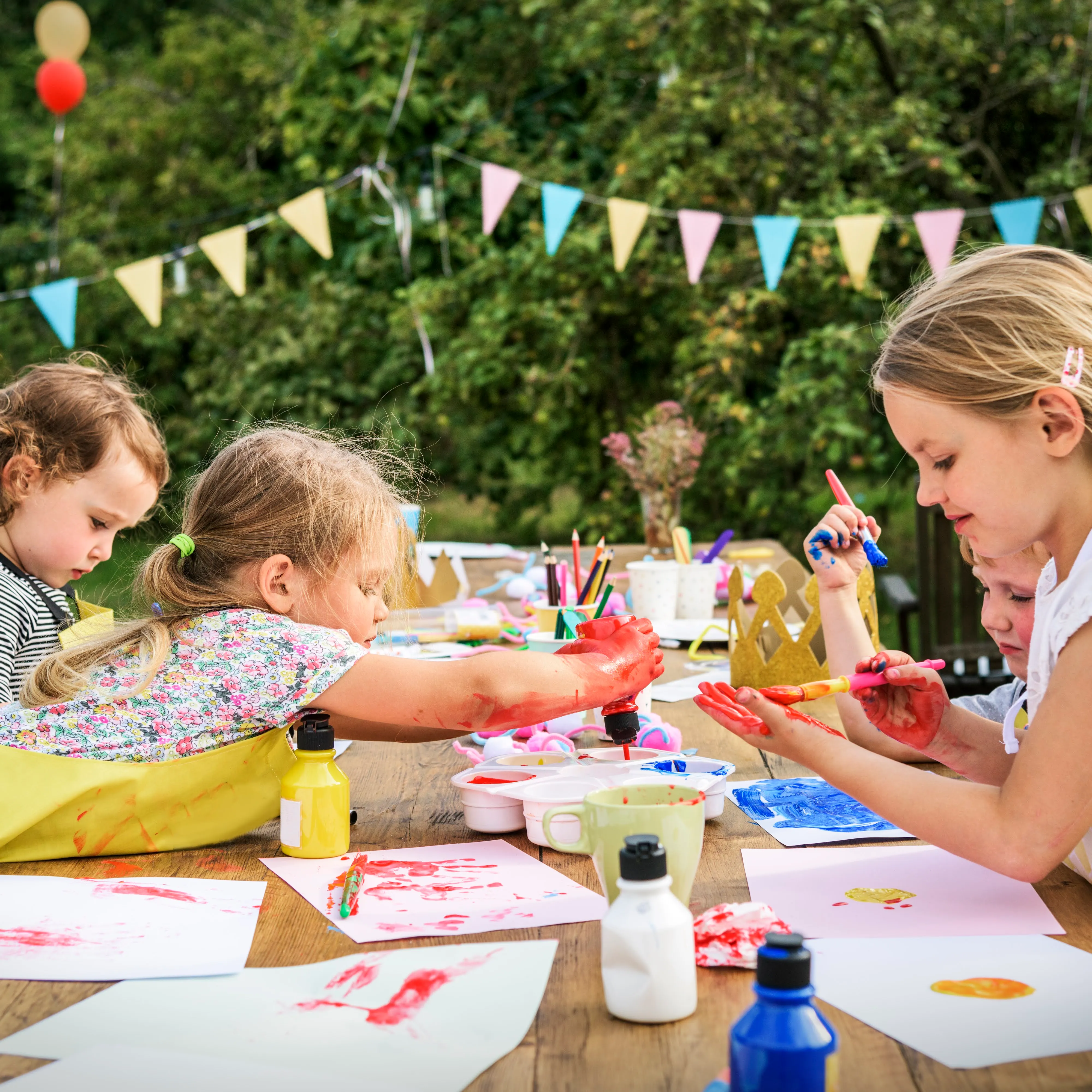 Children having fun painting at an art party