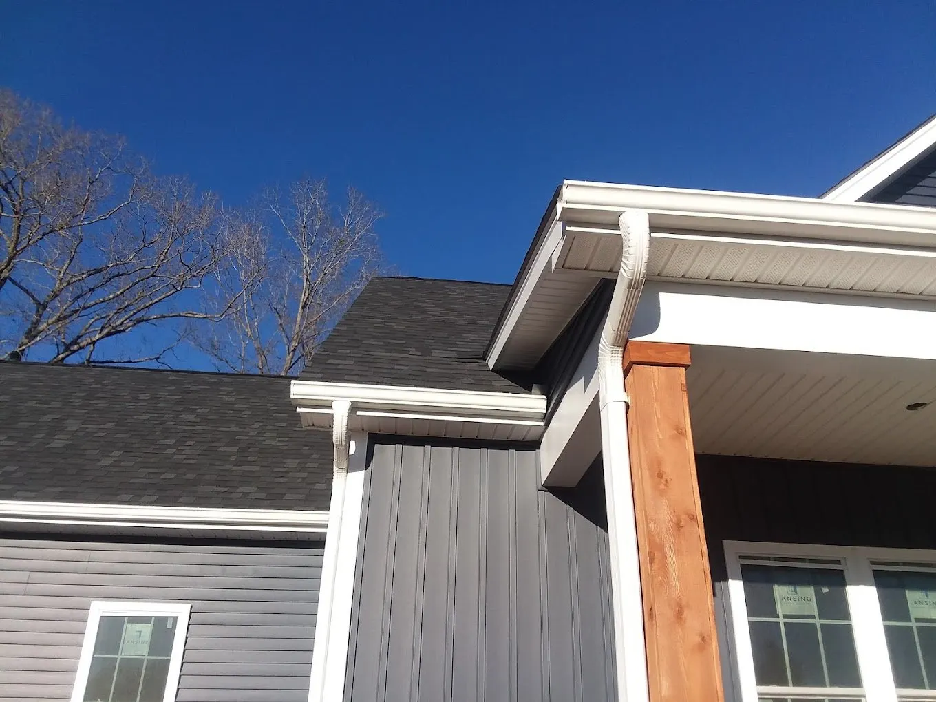 closeup of happy customers home with new seamless gutters