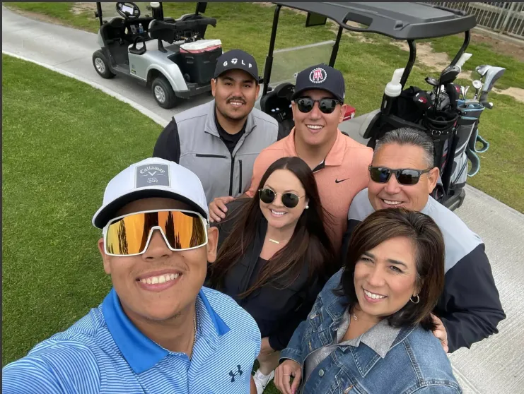 family golfing