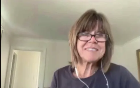 Marilyn Southern Smiling wearing brown blouse