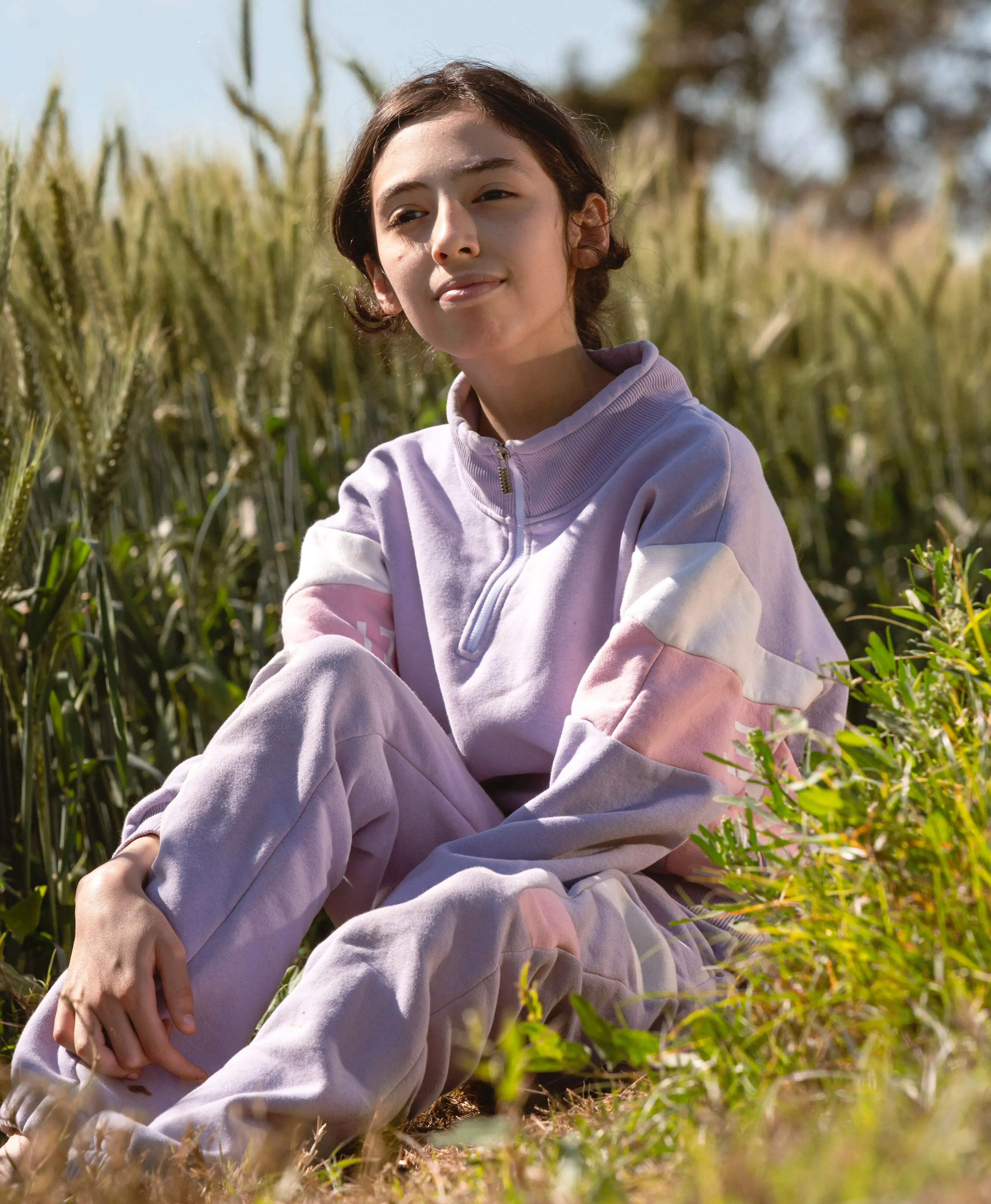 Girl in tracksuit in the field