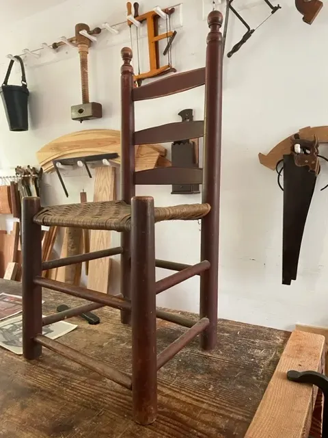 historic chair that represents several being  constructed by the Colonial Williamsburg joiners for the Bray School exhibit