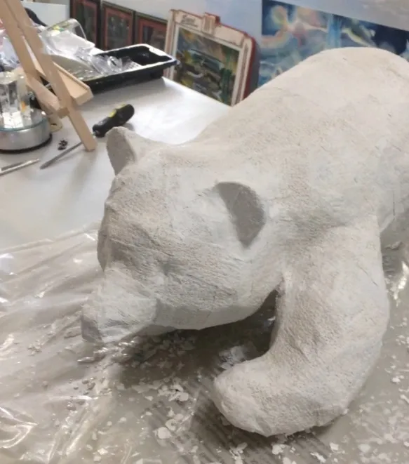 alt=Plaster bear sculpture