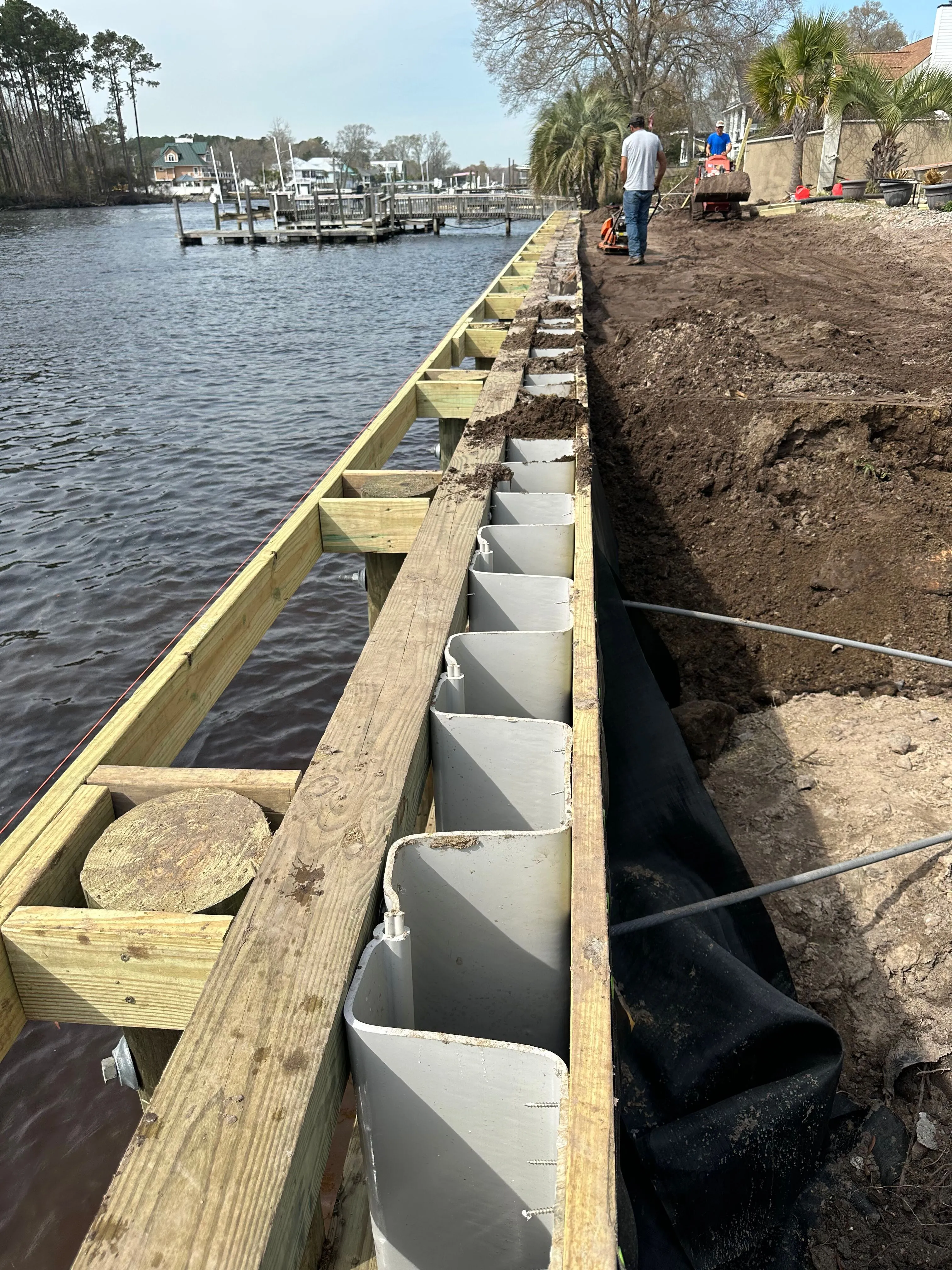 Vinyl Bulkhead framed out for composite wood cap under construction in Myrtle Beach SC on the Intracoastal Waterway built by Waterbridge Contractors of the Carolinas
