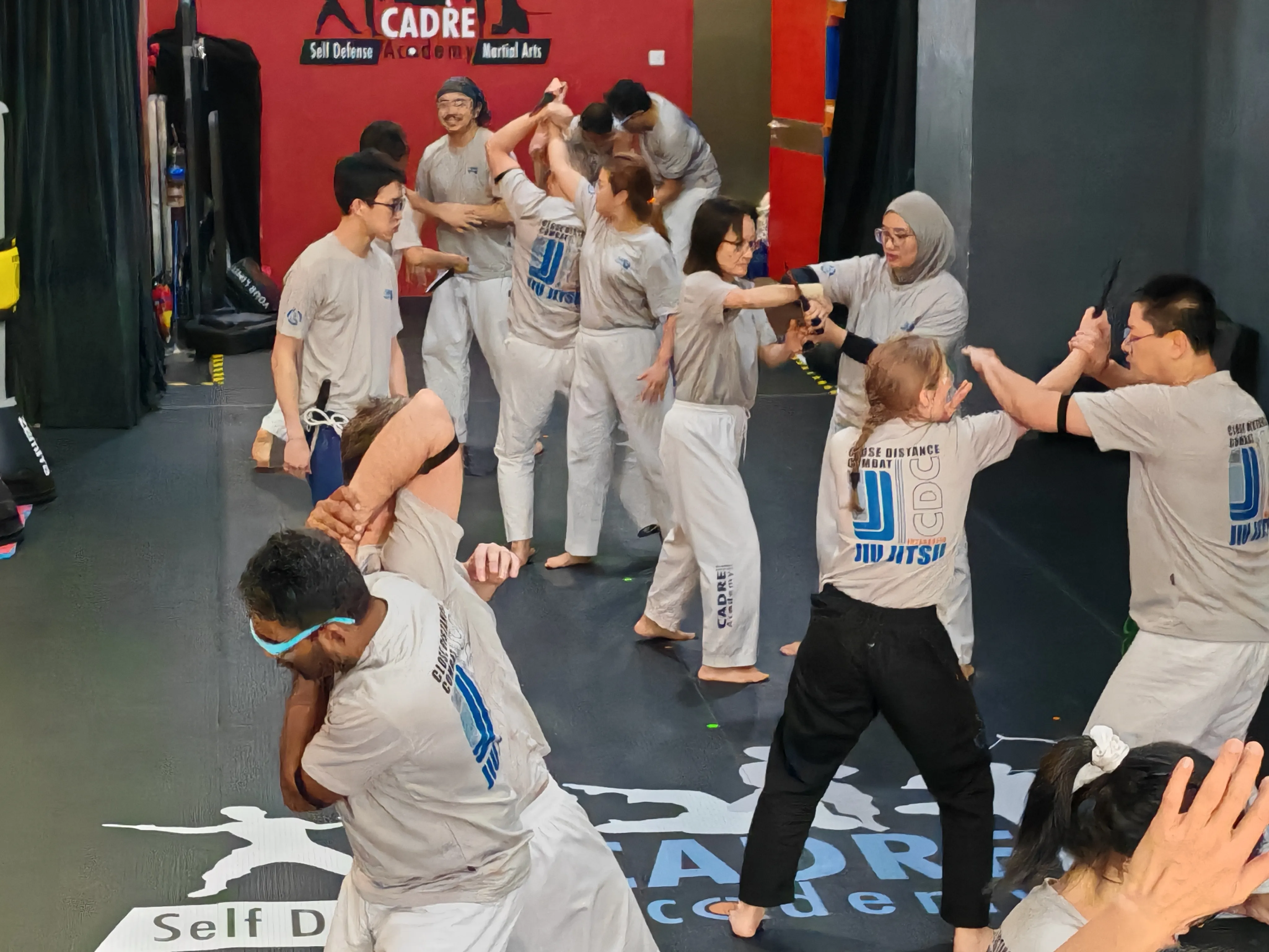 Adult self-defence training class at CADRE Academy in Singapore