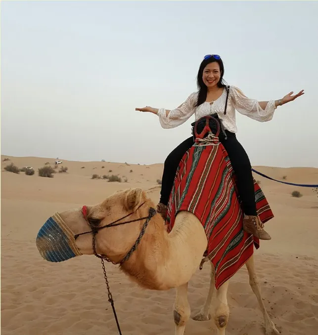 Join Dr. Ma Cherie Cortez on a thrilling camel ride in the Dubai Desert Safari, integrating adventure into her transformative retreat programs. Discover how her unique approach combines professional development with exciting desert activities for an unparalleled growth experience.