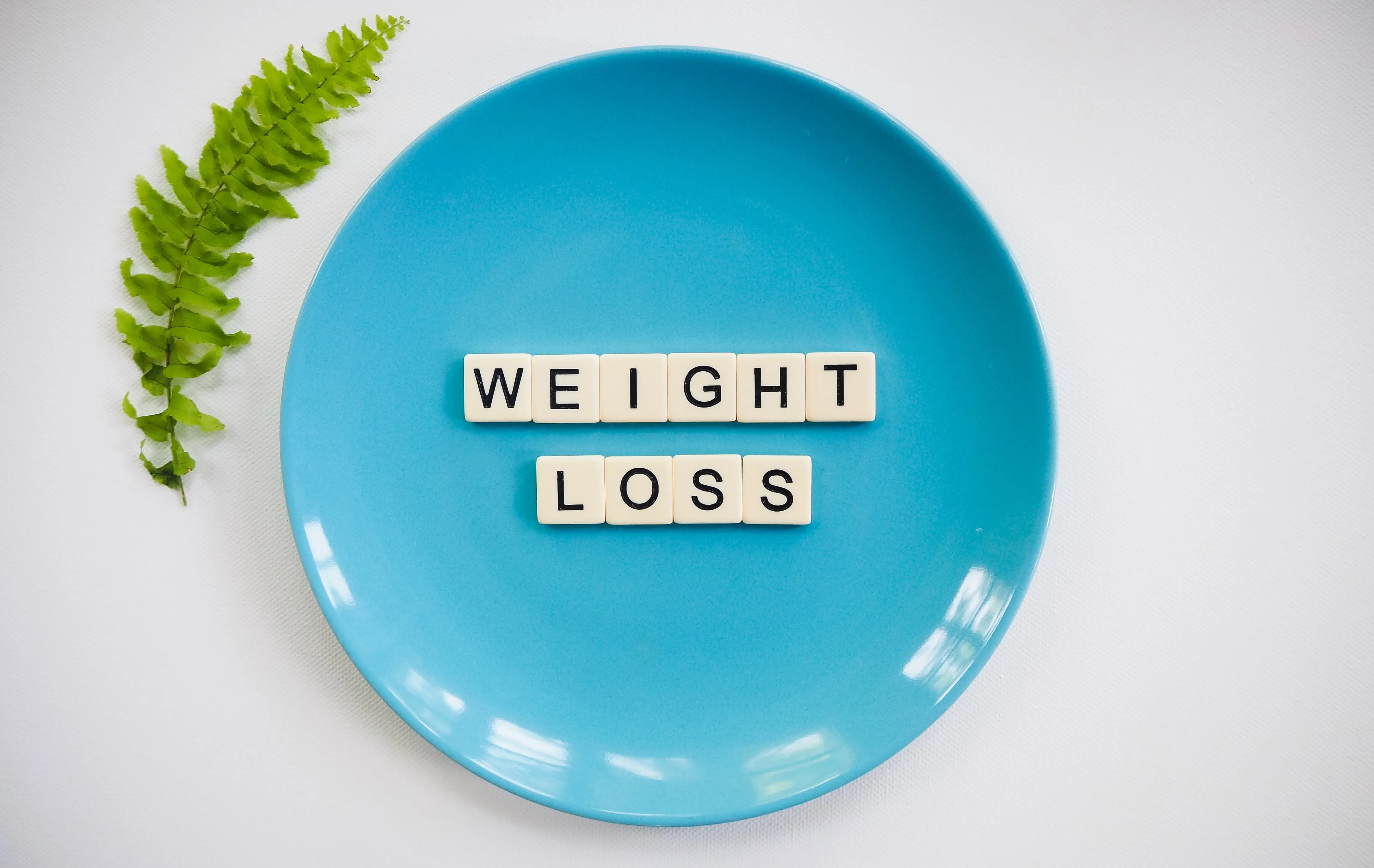 weight loss spelt out on a plate.