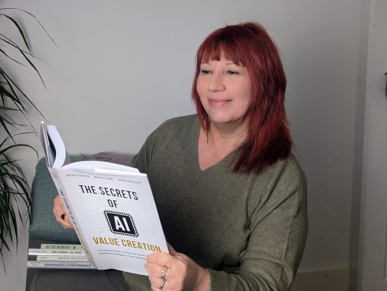 Sian Harrington reading a book on AI