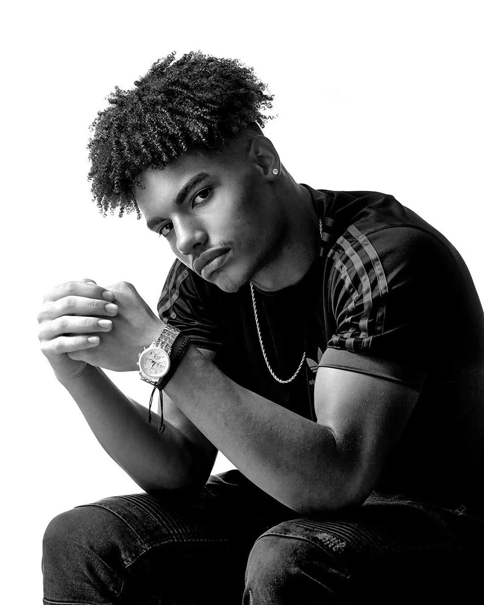 Black and white modeling portrait of dark skinned man