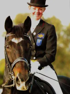 Leanne with her horse Avoca Black Saint at a dressage competition
