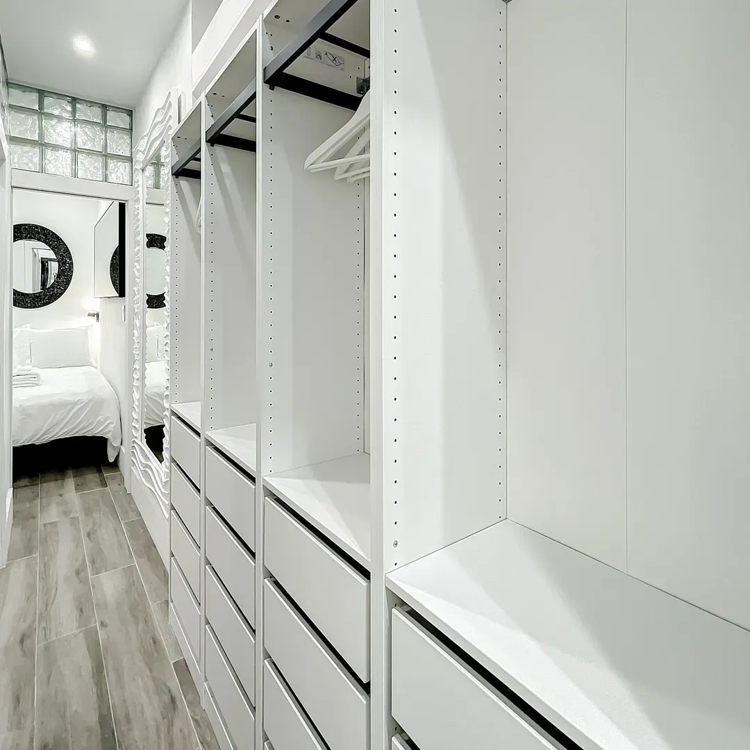 The master bedroom truly stuns with a custom-built walk-in closet rivaling boutique dressing rooms.