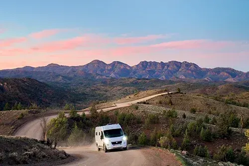 Campervan travelling through the Flinders Ranges landscape in South Australia