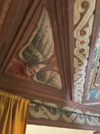 red-haired angel carved into medieval ladys bed for fertility