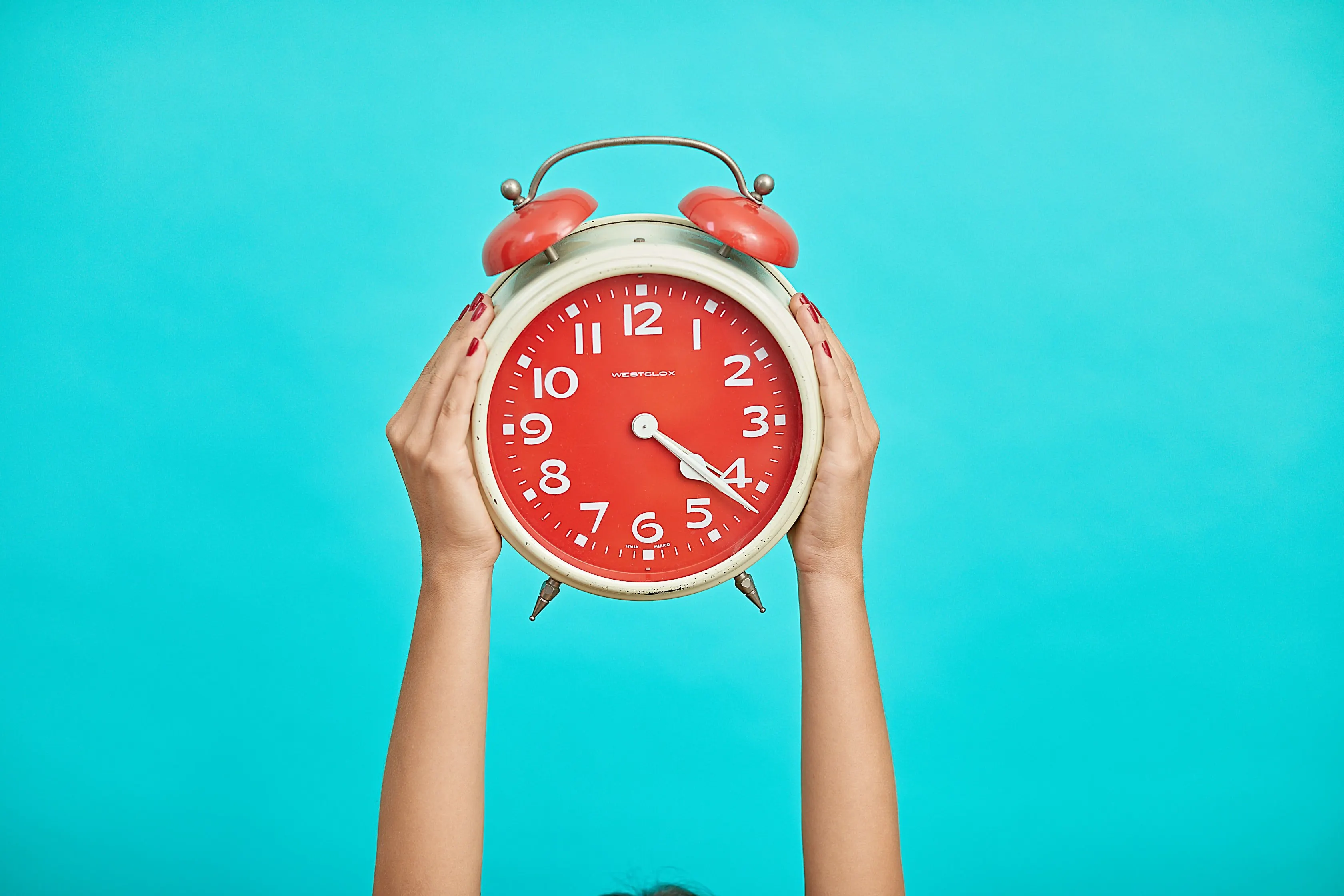 woman holding up clock to save time with doorstep valet trash service