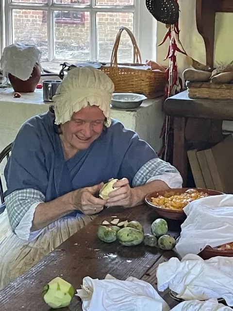 historic foodways program preparing pawpaw fruit in the Colonial Williamsburg Palace Kitchen