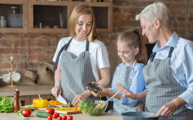 Family preparing salad for dinner