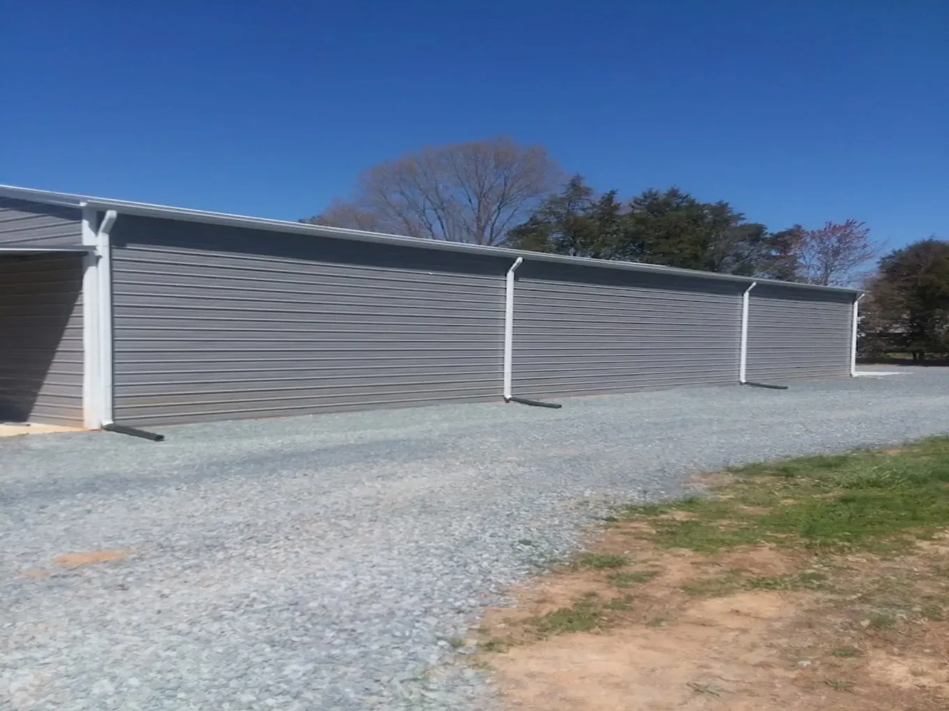 white seamless gutters on a metal building