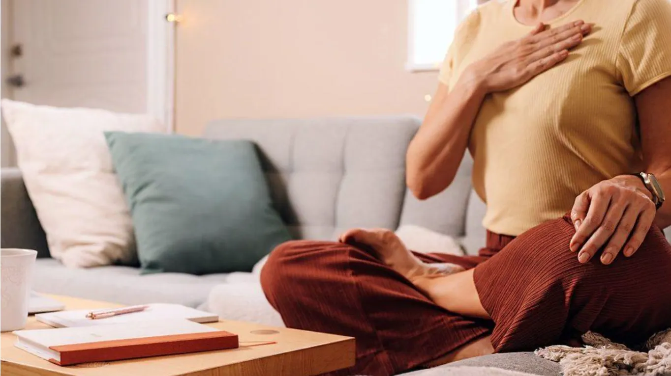 sitting cross legged meditating