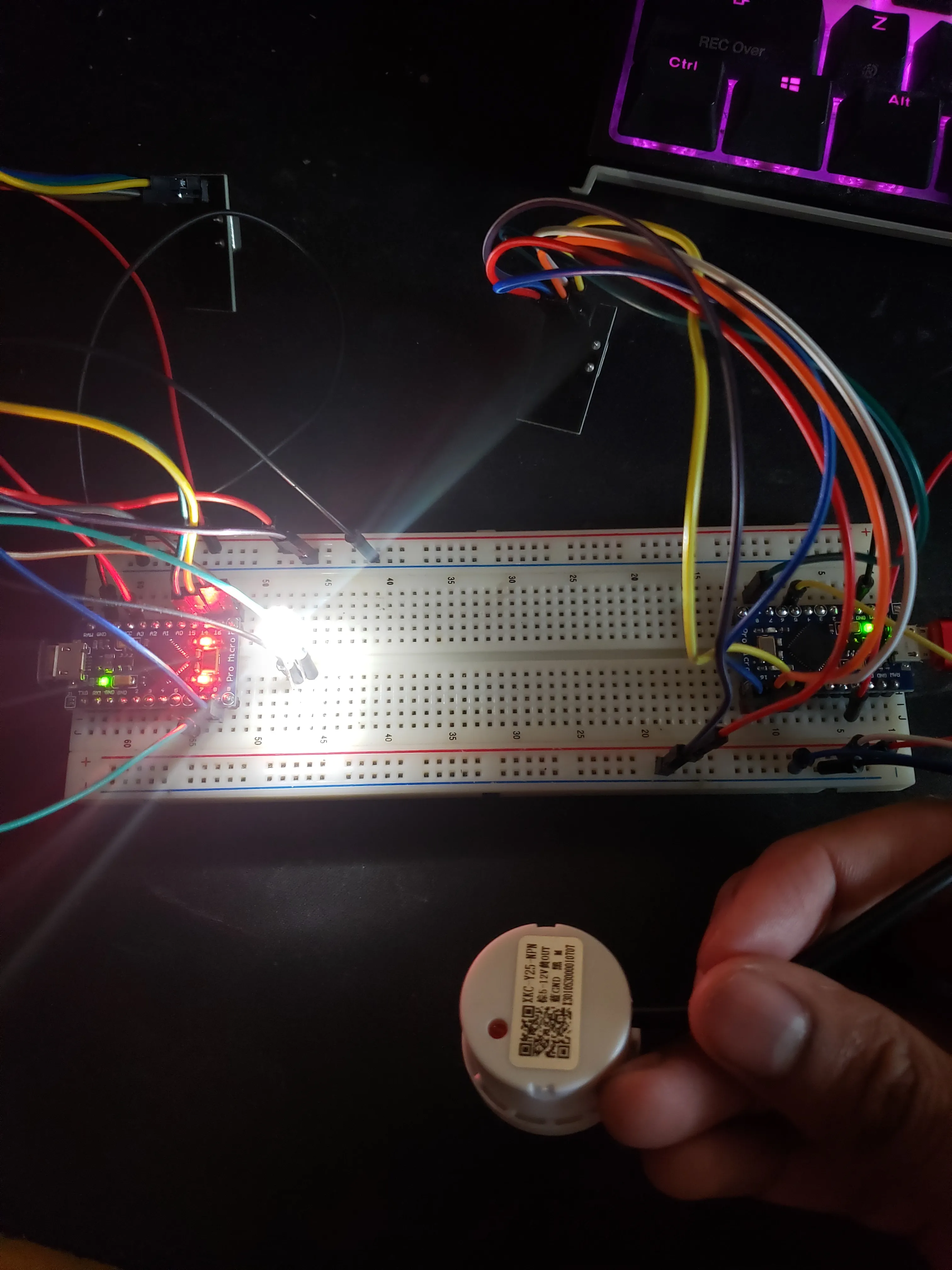 Nothing over the non contact fluid sensor shows that the led on the other micro is on, therefor simulating that the water level is below the sensor.