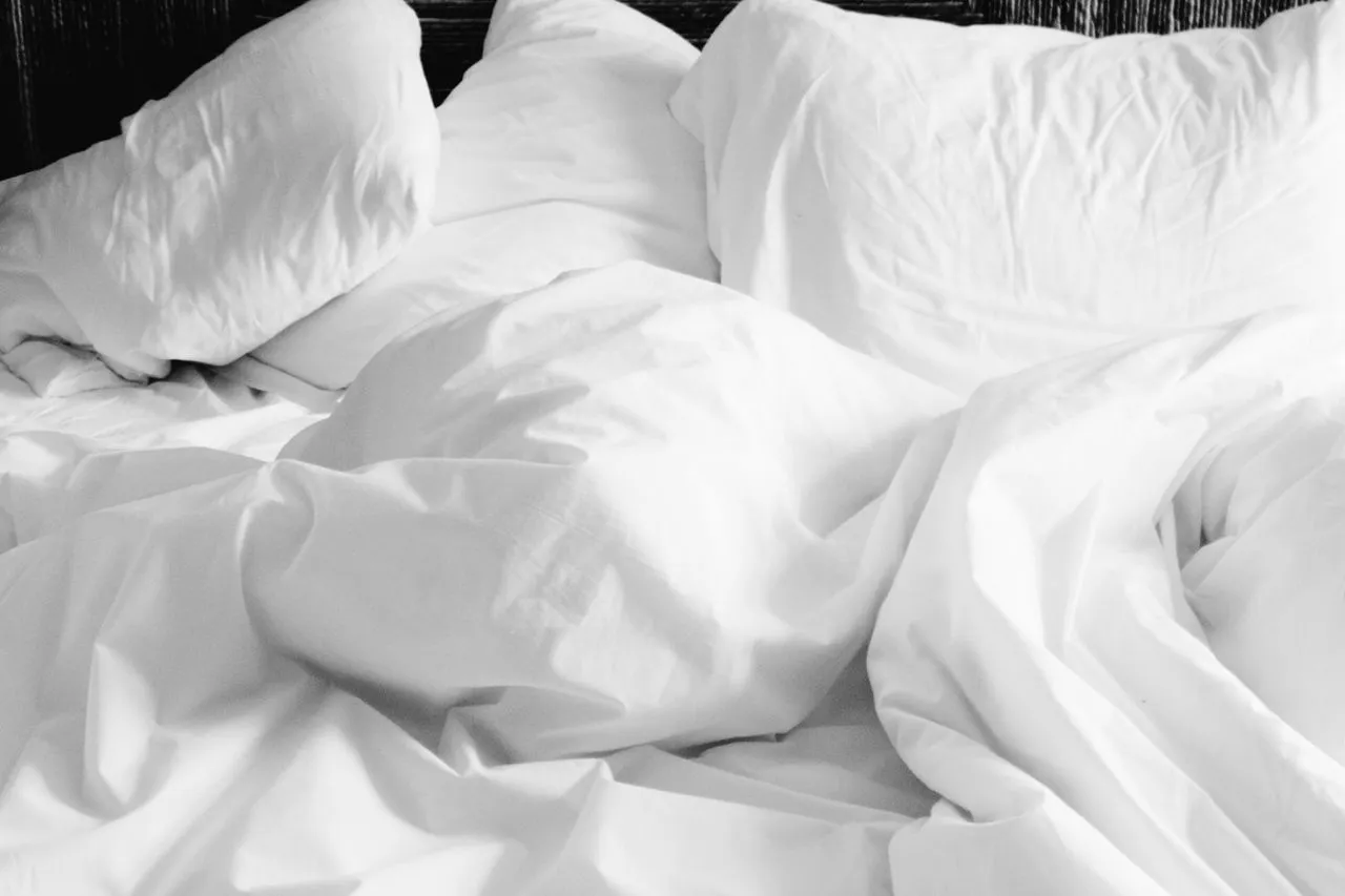 Person relaxing and preparing for a restful night's sleep