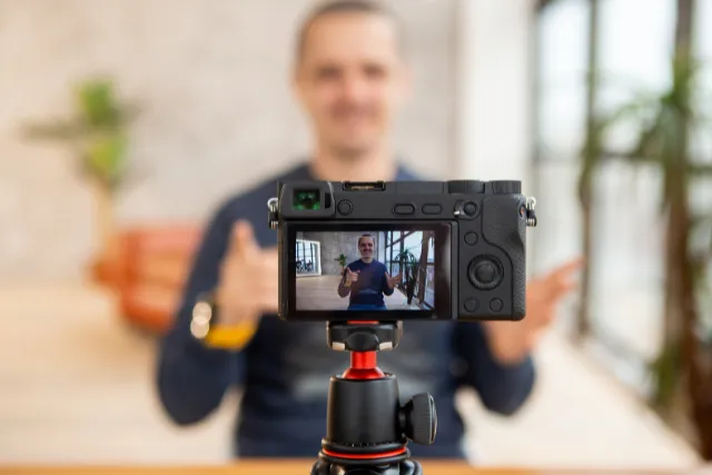 man creating a video with a camera