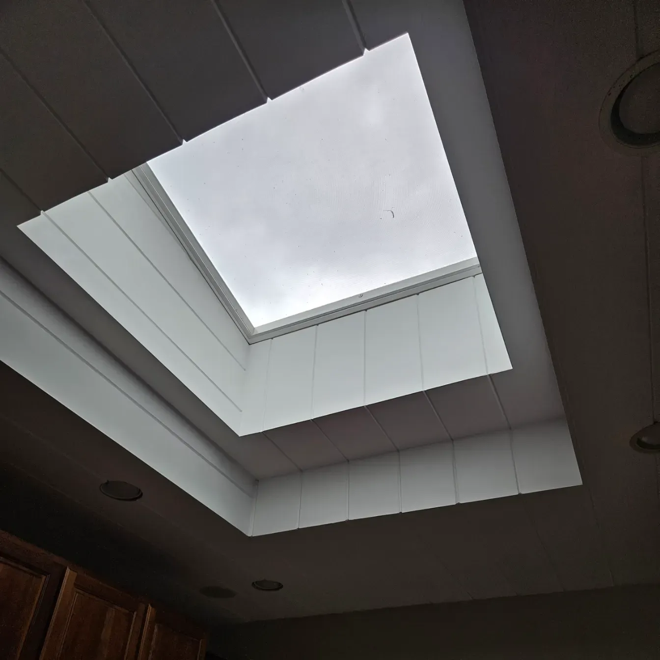 Skylight installation bringing natural light into a kitchen