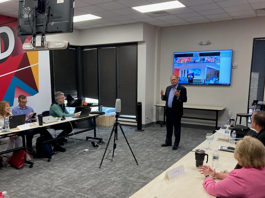Charles speaking in a learning classroom