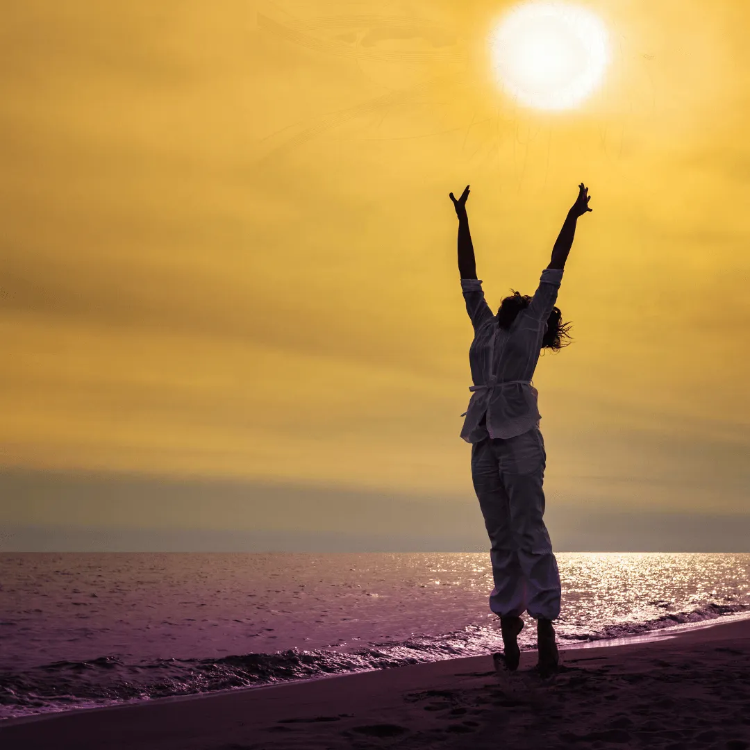 Woman with unblocked energy standing on beach