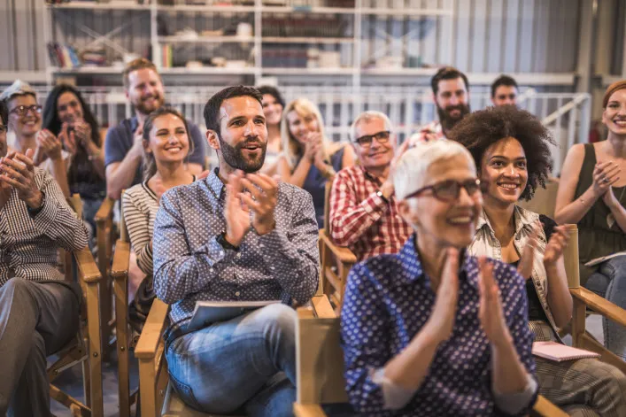 Homeowners happily attending association meeting. 