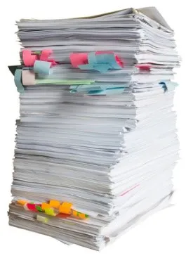 a stack of resumes pile high