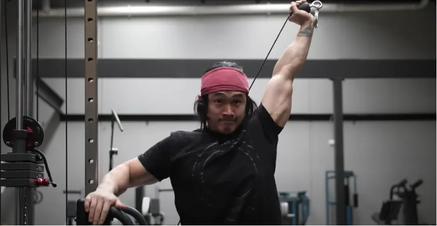 An image of man doing the Katana Triceps extension with a cable.