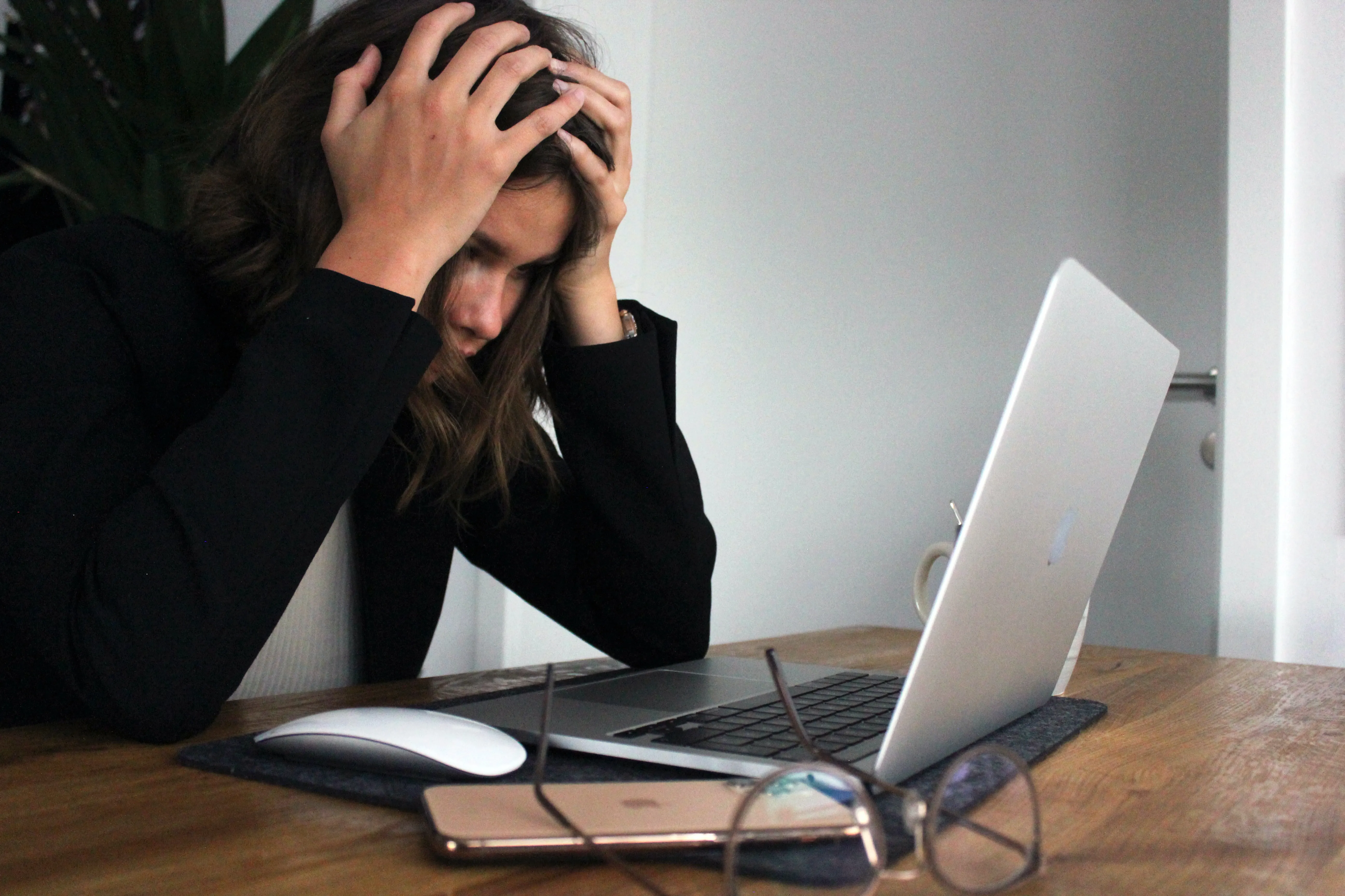 woman staring at her laptop