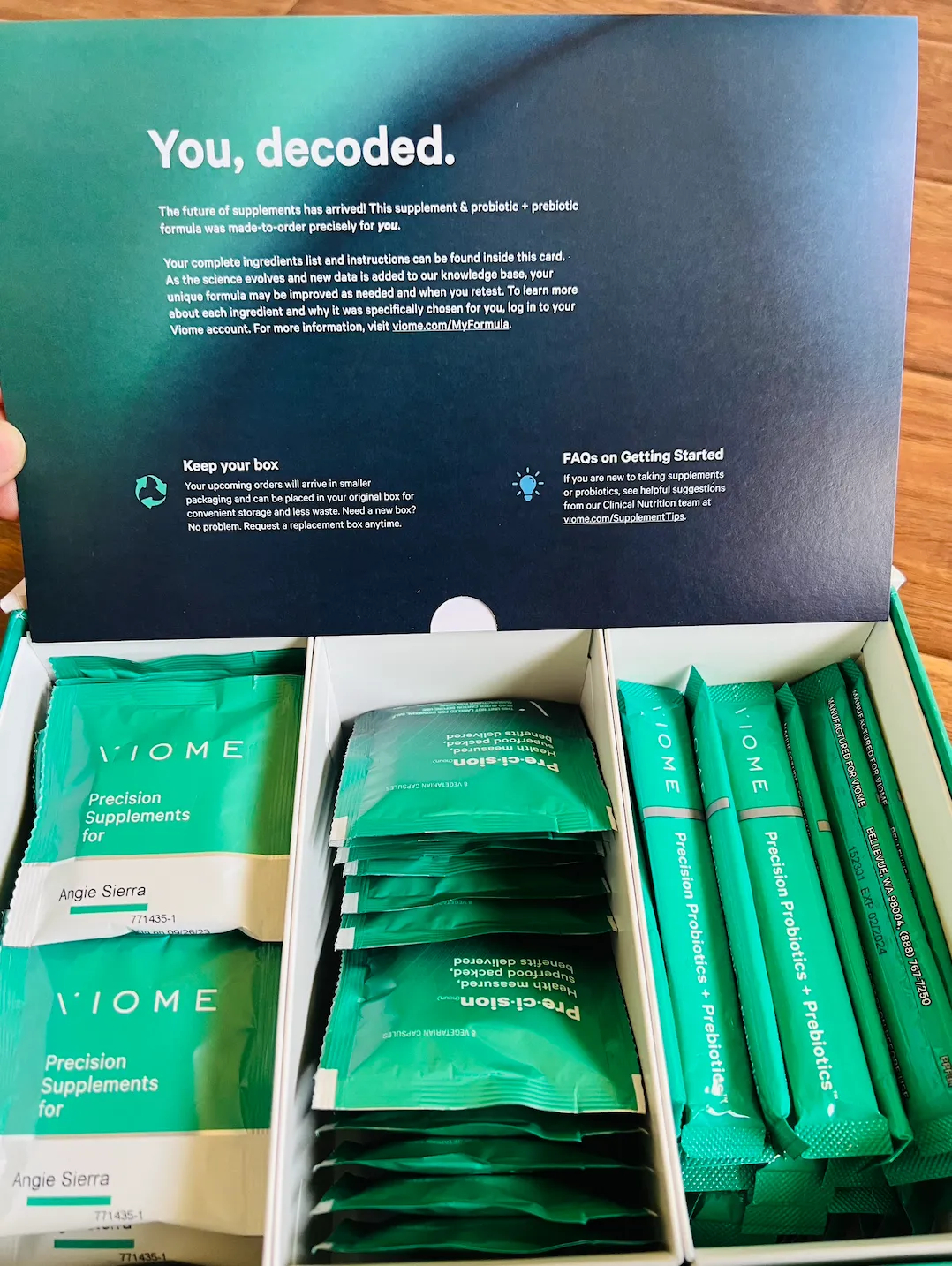 Viome Precision Supplements and Probiotics + Prebiotics box, personalized for Angie Sierra. The image shows green packets of precision supplements and probiotics with packaging instructions, highlighting Viome’s customized supplement formula based on individual health data.