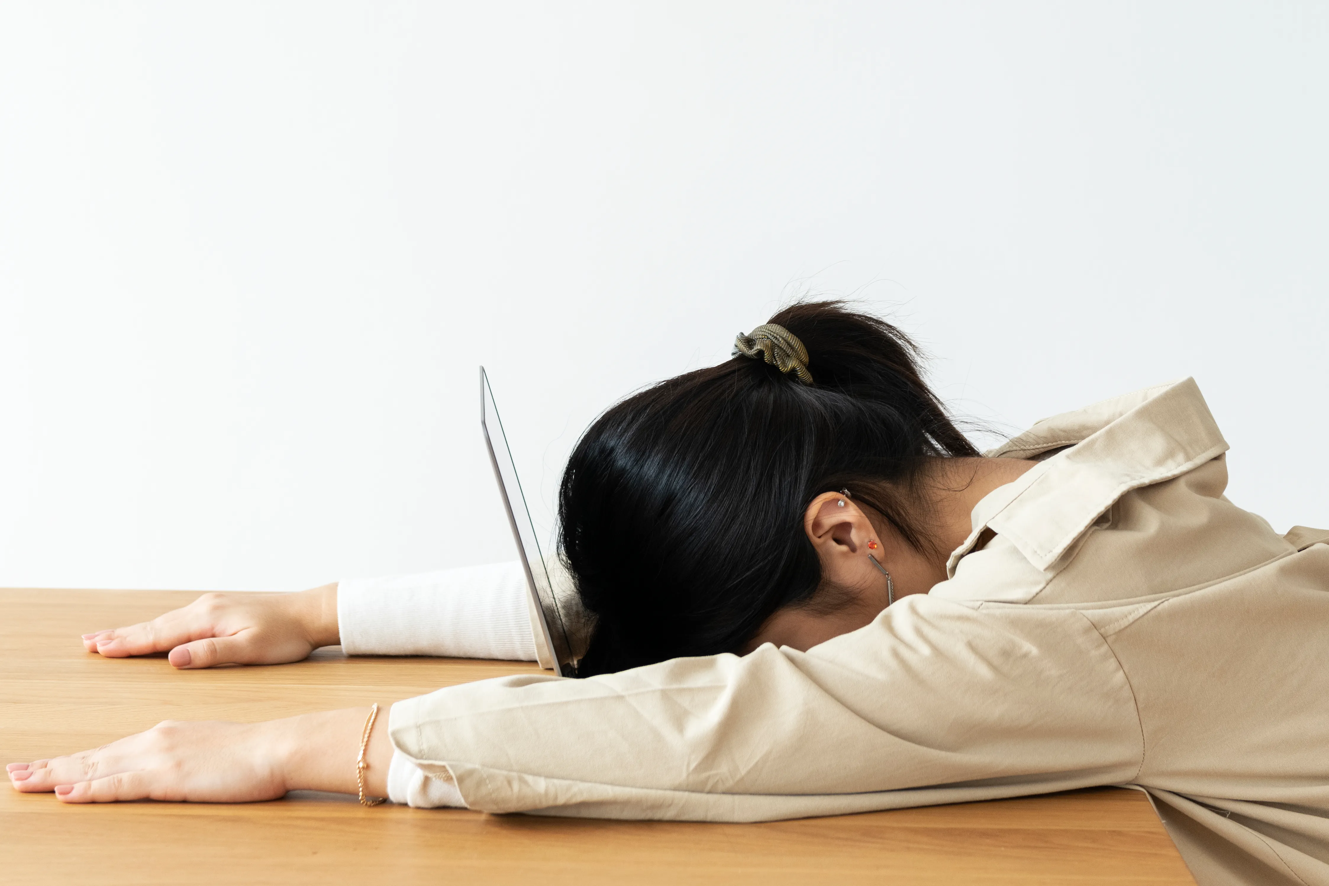 woman exhausted at desk sleeping
