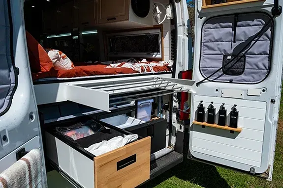 Bushman 30 litre freezer and storage drawers in campervan garage