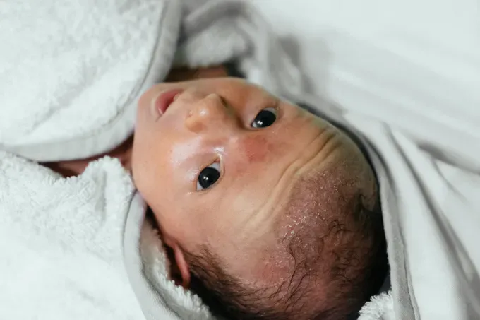 new born baby preparing for first bath