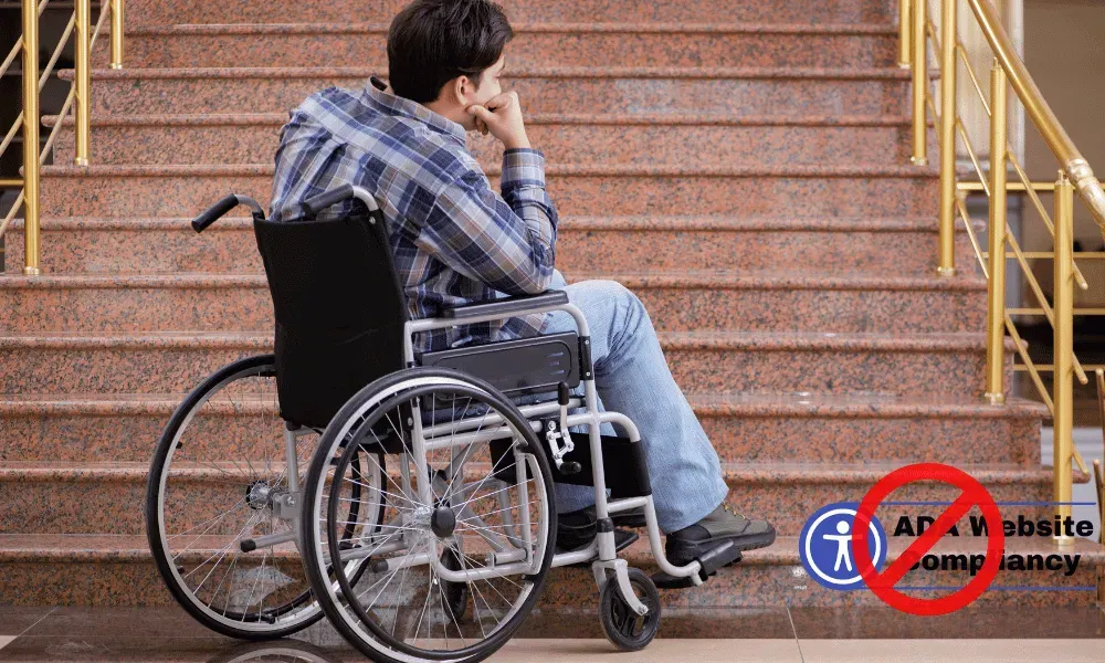 man in wheelchair with no ramp accessabilty