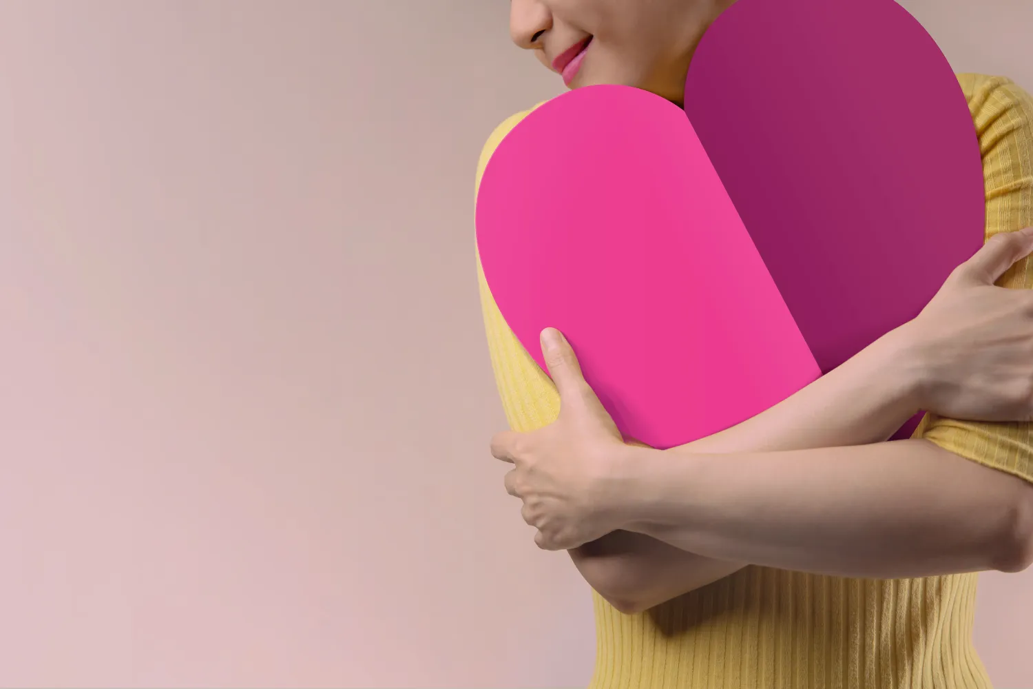 image of girl hugging a pink heart