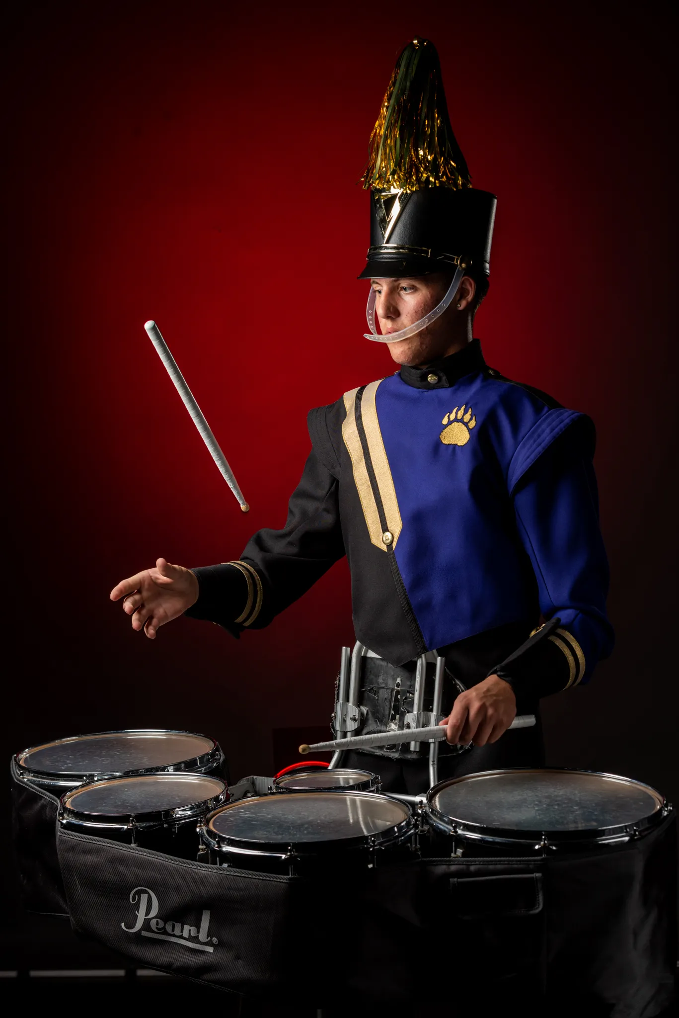 marching band member playing drum