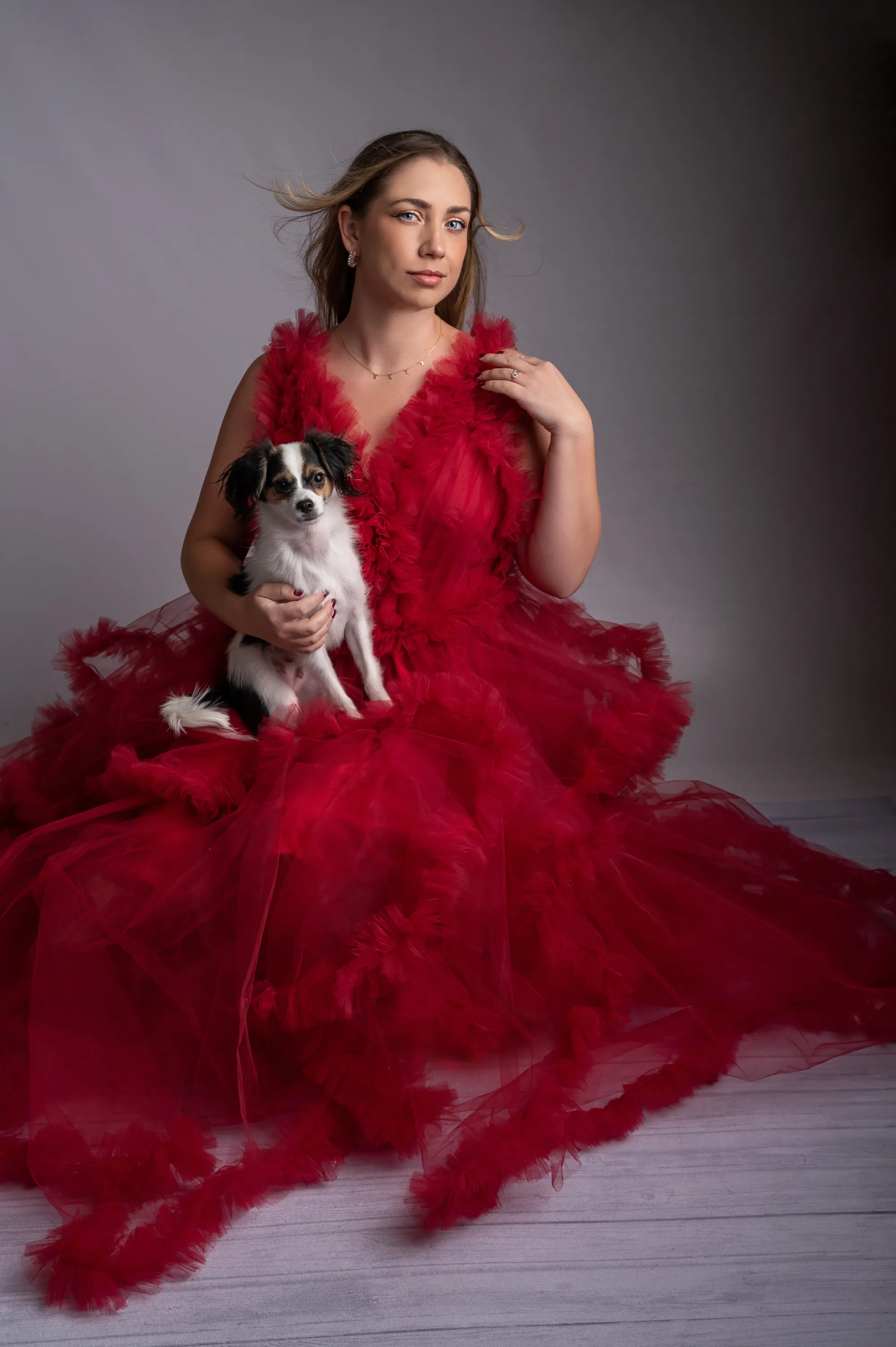 Woman in red dress with small dog 3